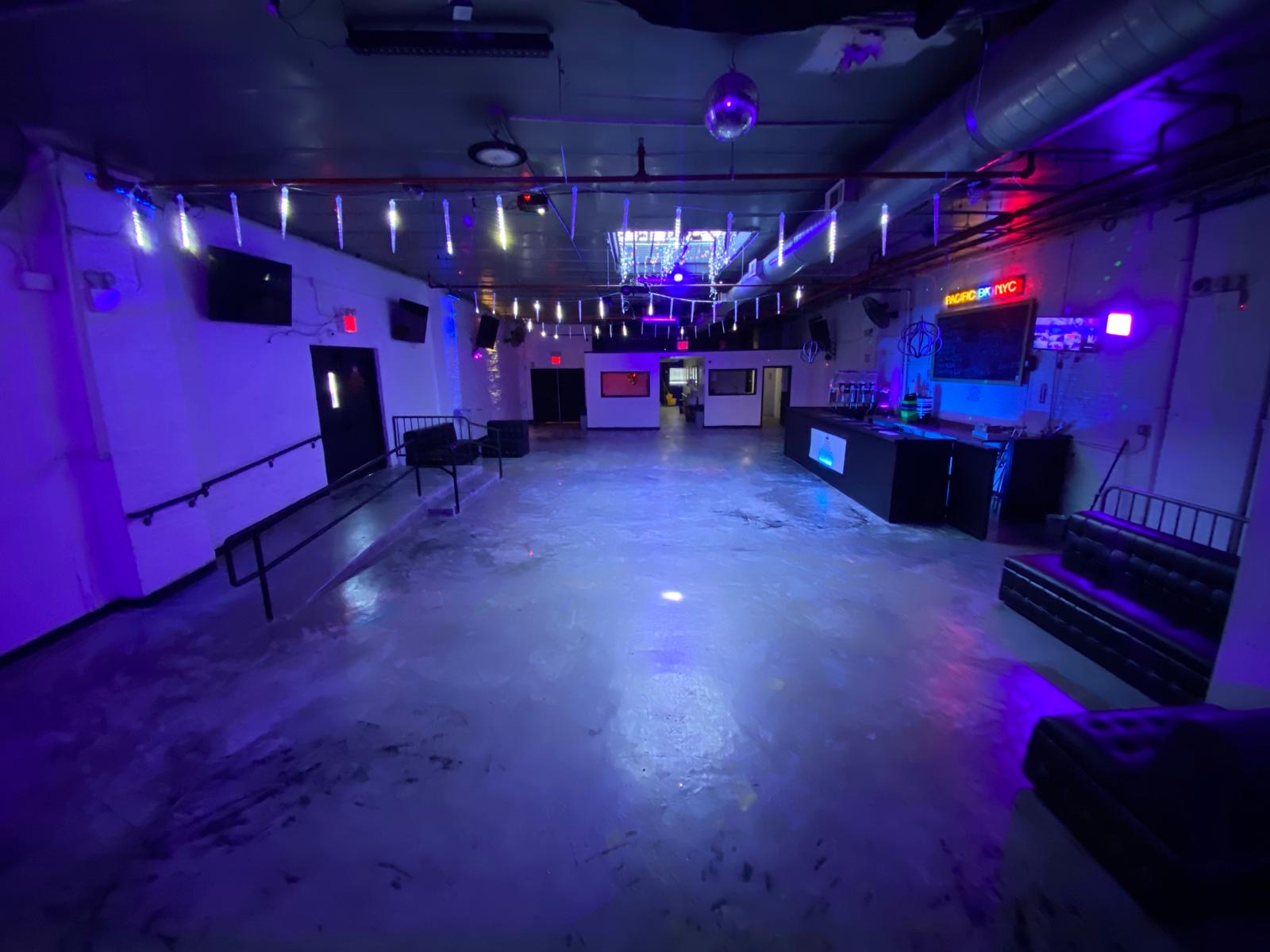 Inside Pacific BK NYC: the spacious event floor, bar, lounge seating, and celebration lighting